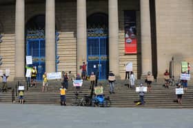 Members of Extinction Rebellion Sheffield took part in solo protests outside City Hall, holding placards expressing their demands and visions for after the coronavirus lockdown. Picture: Chris Etchells