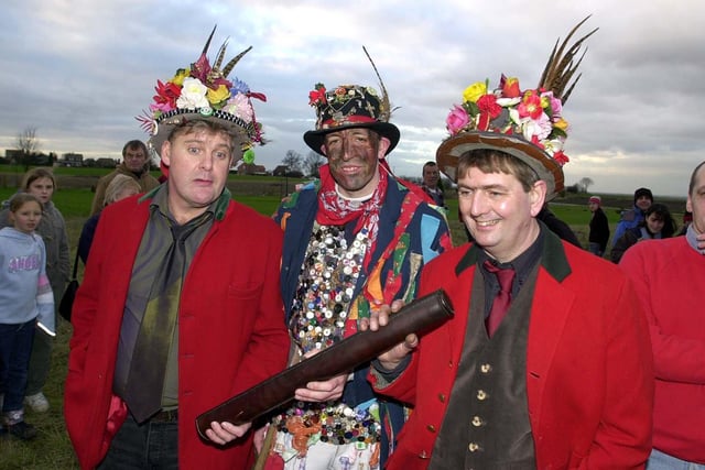 Chief Boggin Ian Dawes (left), Fool Dale Smith (centre) and Lord of the Hood Phil Coggan and the famous Hood in 2004