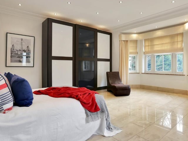 The second bedroom is almost as fabulous as the first, boasting a large, fitted wardrobe and its own en suite. A bay window at the front and a side window offer a good amount of natural light.