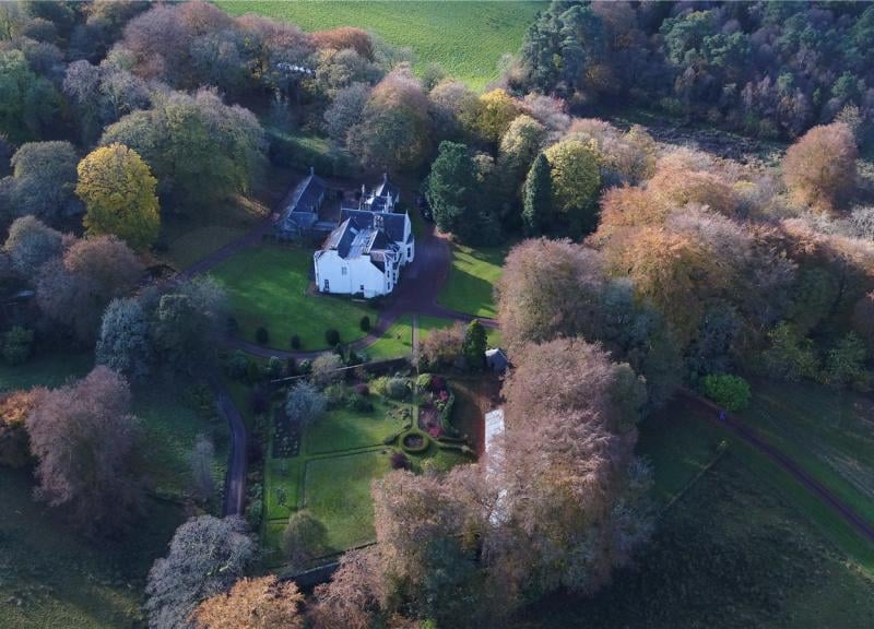 Aerial view of house and grounds.