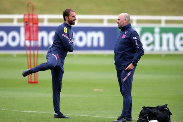 Dr Ian Mitchell, formerly of Sheffield United, with England manager Gareth Southgate at a training session last month: Nick Potts/PA Wire.