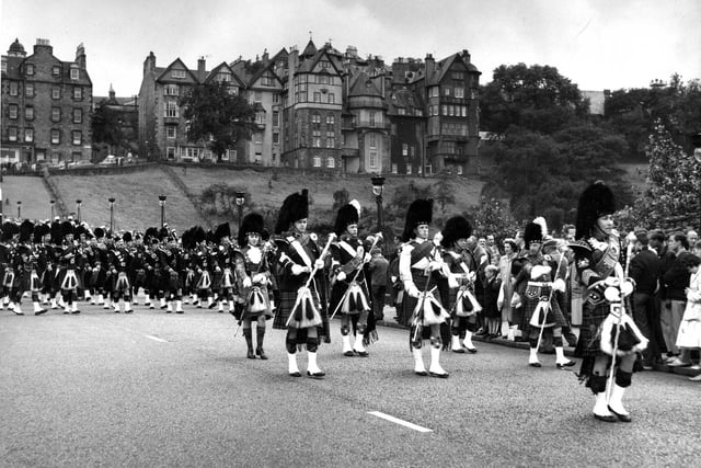 Drum Major Cockburn leads bands down the Mound as part of a piping competition held in Edinburgh in August 1960.