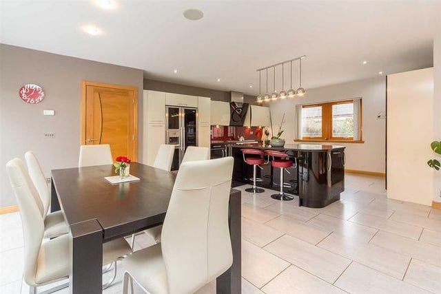 The expansive kitchen is a great family and entertainment space which boasts underfloor heating, and looks out over the front of the house to the driveway and to the south-facing garden