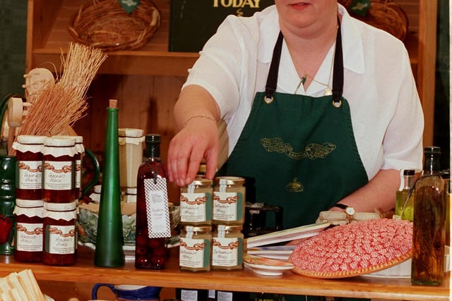Gill Salmon manager of the Bakewell Pudding shop puts the finishing touches to her display at Bakewell Show in 1998