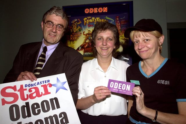 Doncaster Star general manager Mike Davies handed over the prize Odeon cinema tickets to winner Ruth Gosden (centre), of Wheatley, watched by cinema customer sales service assistant Mel Richardson in 2000