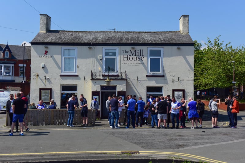 Pools fans have some refreshments outside the Mill House ahead of their return to The Vic