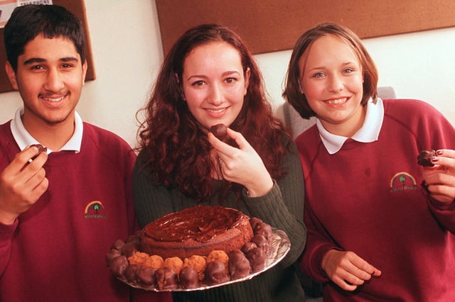 These two Mrytle Springs students 'Gave it up for Ghana' in 1999 and where rewarded for their efforts with a cake made free by the blue moon cafe. Left to right are, Gurprit Jabbal, 14, Oxfam sheffield campaigner Fernanda deGouveia and 14 year old Gina Barrett.