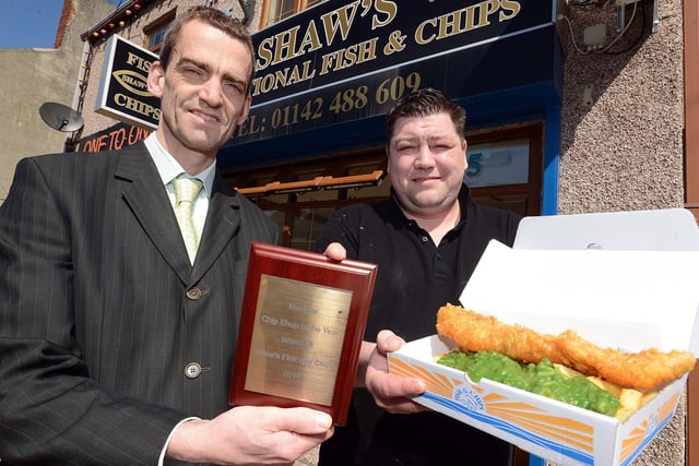 Rob Hollingworth from The Star presents a plaque to Richard Shaw when Shaw's in Killamarsh was named the paper's Chip Shop of the Year in 2014
