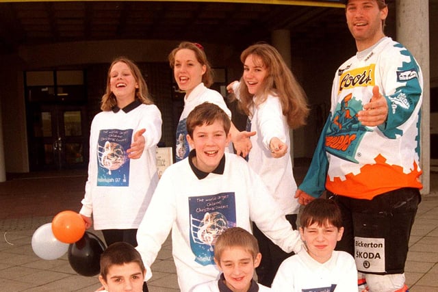 Pictured at the Sheffield Arena in 1997, where Steelers player  Frank Kovacs joined children from Yewlands School, who were preparing to sing in the Hallelujah Christmas Concert