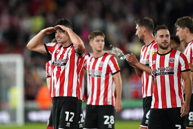Sheffield United's John Egan (left) has been a key man this season and is reportedly attracting interest from Leeds: Tim Goode/PA Wire.