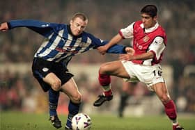 9 May 2000:  Alan Quinn (L) of Sheffield Wednesday grapples with Silvinho (R) of Arsenal during the FA Carling Premiership match at Highbury in London.  The match was drawn 3-3. \ Mandatory Credit: Jamie McDonald /Allsport