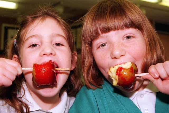 Copley Junior school pupils Jessica Boulton and Rachel Nicol, both seven, biting into toffee apples in 1998.