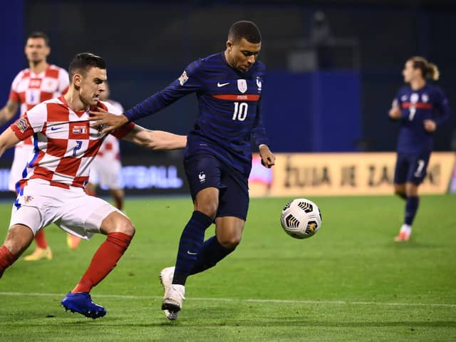 France's forward Kylian Mbappe (R) vies for the ball with Croatia's defender Filip Uremovic  during the UEFA Nations League Group A3 football match between Croatia and France at the Maksimir Stadium in Zagreb on October 14, 2020. (Photo by FRANCK FIFE / AFP) (Photo by FRANCK FIFE/AFP via Getty Images)