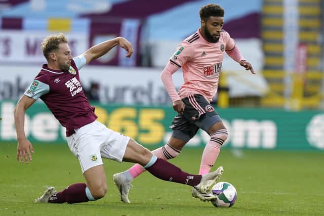 Jayden Bogle of Sheffield Utd (R) is tackled by Charlie Taylor of Burnley during the Carabao Cup match at Turf Moor, Burnley. Andrew Yates/Sportimage