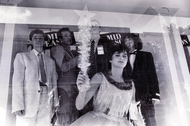 Rag students puzzle the passing shoppers as they pose in Debenhams window on October 22, 1987