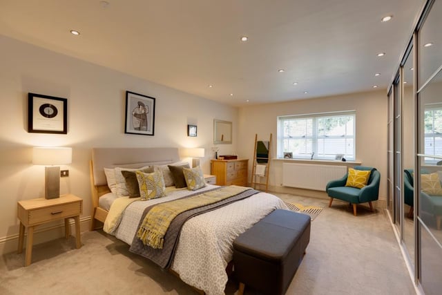 This is the master bedroom - it has rear facing timber double glazed windows and a range of fitted furniture incorporating short hanging and shelving.
