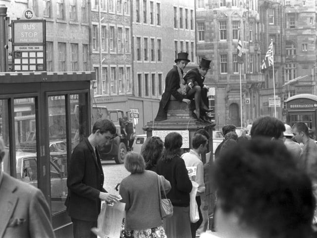 Two performers promoting their show outside the Edinburgh Festival Fringe office in the High Street, August 1983.