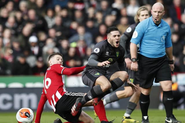 Oliver Norwood of Sheffield Utd tackles Emi Buendia of Norwich City  during the Premier League match at Bramall Lane, Sheffield. Picture date: 7th March 2020. Picture credit should read: Simon Bellis/Sportimage