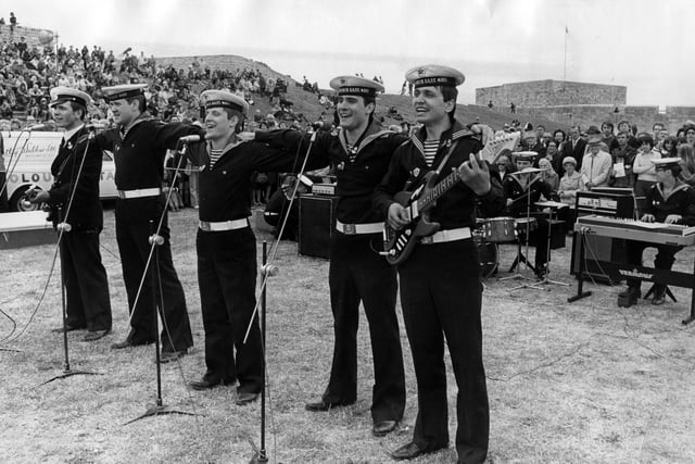 The young pop group, all crewmen from the Russian destroyer Obraztsovy, gave concerts on the grass slopes of Southsea Castle during the holiday weekend, 1976. The News PP5041