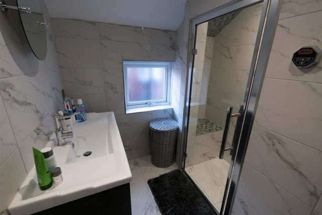 This luxury white suite comprises of a wash hand basin and steam shower.