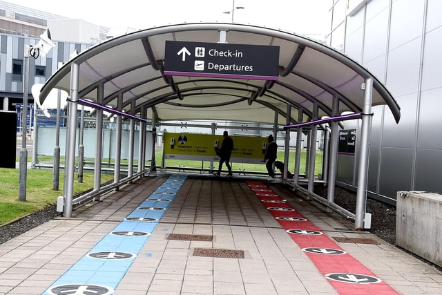 Passengers entering the airport use the blue lane; passengers exiting follow the red lane.