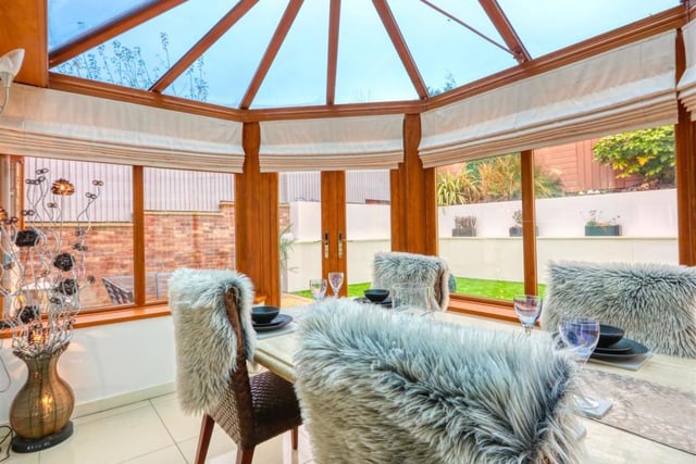 Natural light floods into the rear of the house through a conservatory which enjoys views over the rear garden.