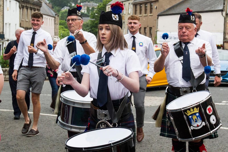 Tenor Drummer Erin Clarkson & the Jedburgh Royal British Legion Pipe Band escort the Principles around the 'Toon'. (Photo: BILL McBURNIE)