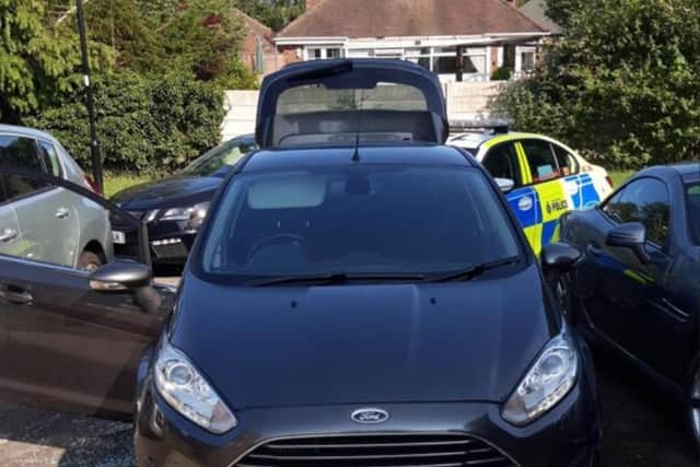 Police said they found two people sleeping inside this Ford Fiesta in Sheffield which had been stolen and fitted with false plates. Photo: South Yorkshire Police