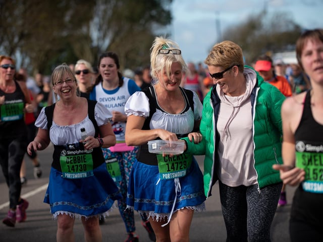 Karen Rule provided sweets to the runners. (201019-252)