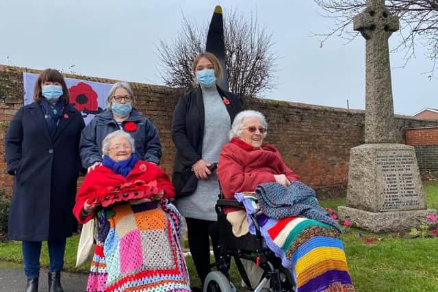 Violet Tandy, right, at a Remembrance Sunday service in Lincolnshire last year with nursing home staff and another resident