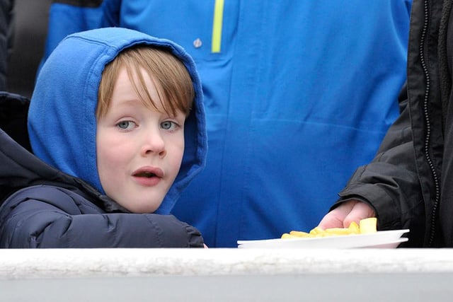 A young fan watches the action unfold at Mariners Park.