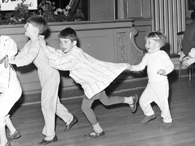 Children in their pyjamas enjoy the Wee Willie Winkie ball, held at the Assembly Rooms in Edinburgh in December 1967