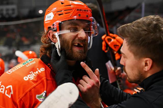 A spot of dental work all in a day's work on the Steelers bench at the Arena. Picture: Dean Woolley