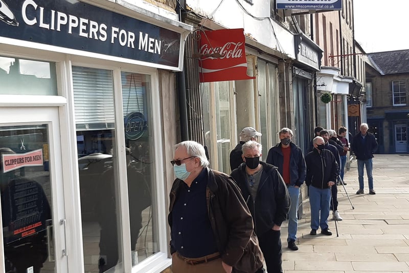 A lengthy queue for Clippers for Men in Alnwick Marlet Place.