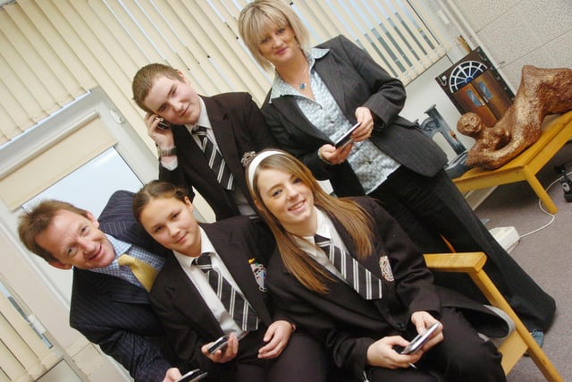 Year ten pupils at Armthorpe School are presented with personal computers to help them during their GCSE's L-R are Head Teacher Nigel Pattinson, Kelly McGhee, Martin Webber, Becky Robson, all 15, and Lorrayne Hall, Centre Manager at Doncaster South City Learning Centre (D9003LR)