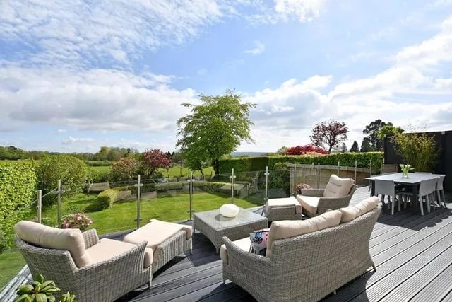 The raised patio to the rear offers an excellent viewpoint down onto the garden, but also across the fields to the rear.