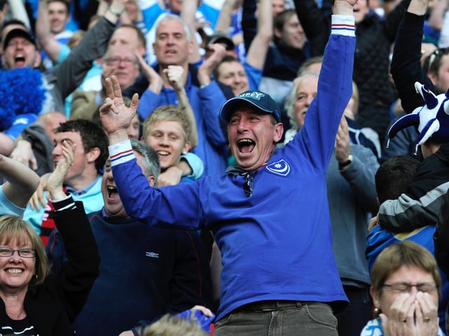 Pompey fans celebrate the 2-0 extra-time victory.