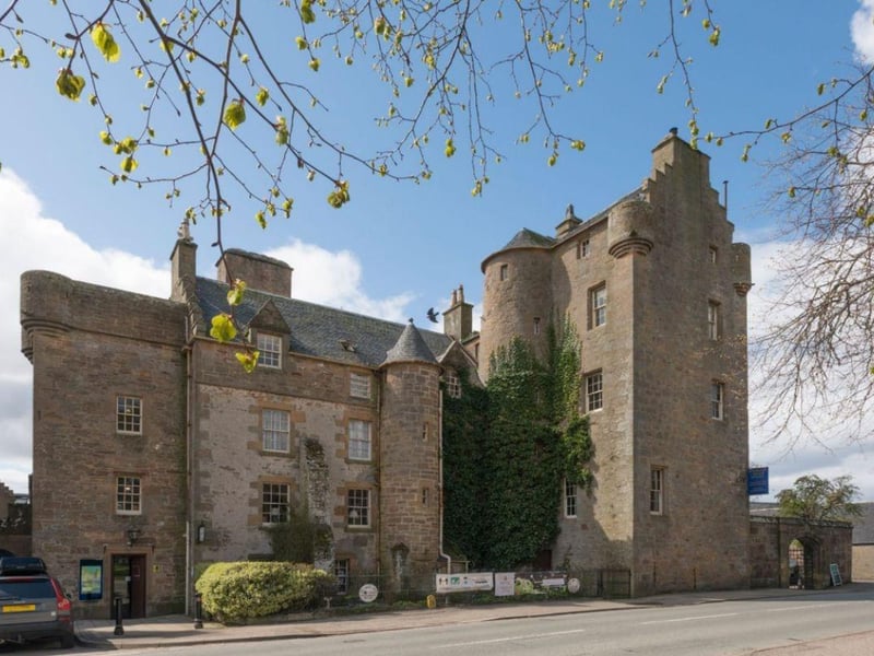 The castle, now a hotel with a famous whisky bar, dates back to the 15th century, and is said to be haunted by a sheep rustler named Andrew McCornish who was imprisoned at the castle and later hanged for his crimes.