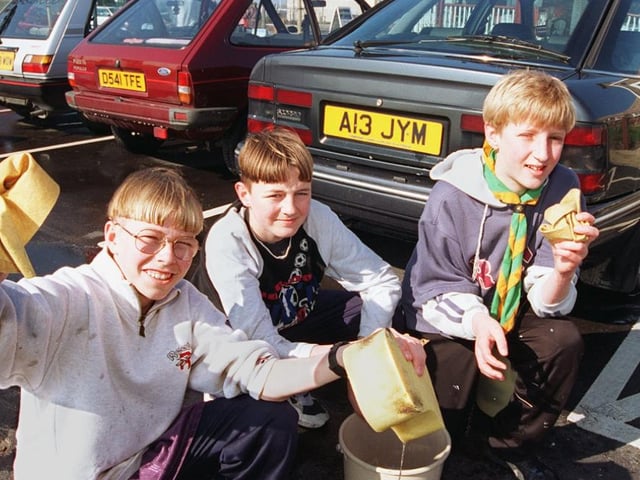 Chris Hurst, 13, Russell Lonsdale 12, Daniel Sharp, 14, with some of the cars they cleaned in 1997