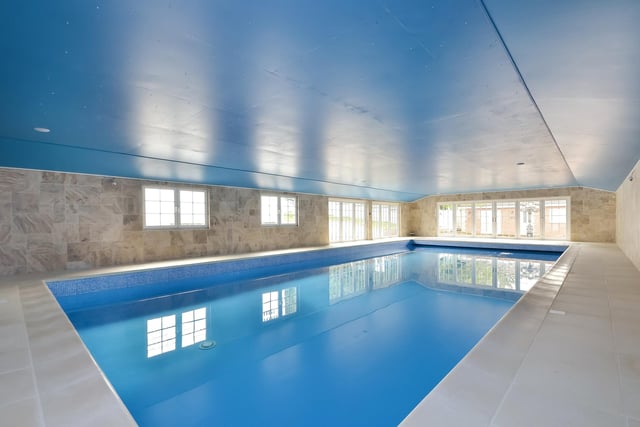 This huge five-bedroom Portsdown Hill home in Portsmouth is up for raffle. Pictured is the property's indoor heated pool. The pool house measures in at 17.58m x 8.86m.