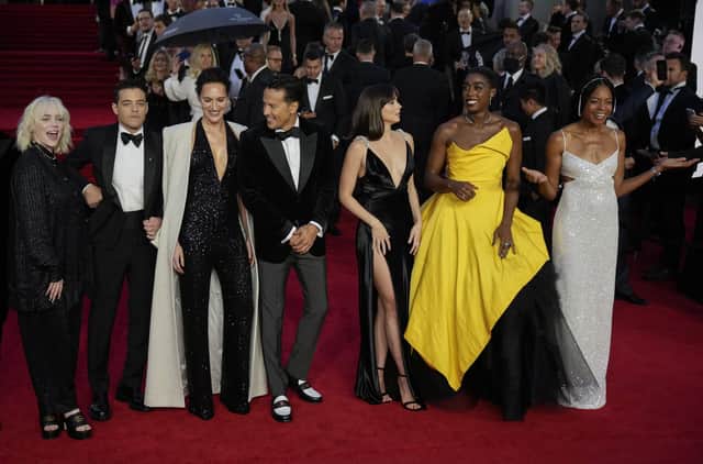 Billie Eilish, from left, Rami Malek, Phoebe Waller-Bridge, Cary Joji Fukunaga, Ana de Armas, Lashana Lynch and Naomie Harris pose for photographers upon arrival for the World premiere of the new film from the James Bond franchise 'No Time To Die', in London Tuesday, Sept. 28, 2021. (AP Photo/Matt Dunham)
