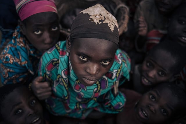 Displaced girls and boys from the Bafuliru community pose for a photograph in the internally displaced persons (IDP) camp of Bijombo, South Kivu Province, eastern Democratic Republic of Congo.