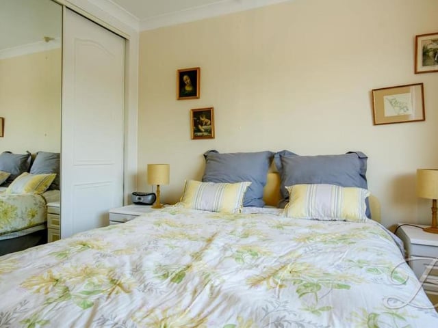The second bedroom is no less attractive than the master. Large built-in wardrobes are welcome.