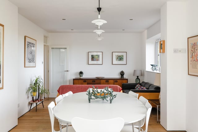 The open-plan dining area is bathed in a wealth of light from the patio doors which lead out onto the garden, providing wonderful views as you eat.