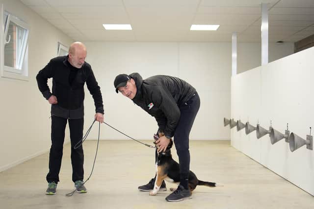 Oostende's head coach Alexander Blessin (R) pictured with COVID-19 detection dog Sammy (Photo by JAMES ARTHUR GEKIERE/BELGA MAG/AFP via Getty Images)