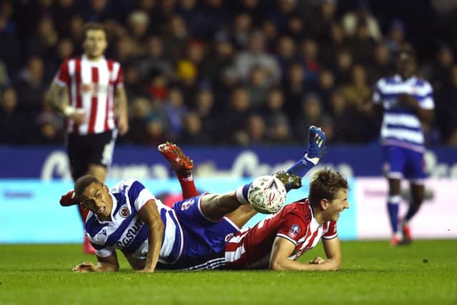 Andy Rinomhota of Reading FC and Sander Berge of Sheffield United clash (Photo by Michael Steele/Getty Images)