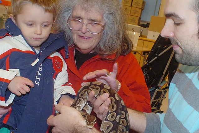Christian Brown and his grandmother Jean Brown met a snake during a rainforest exhibition at Sunderland Museum 14 years ago. Museums keeper of biology Dan Gordon was there to give a helping hand.