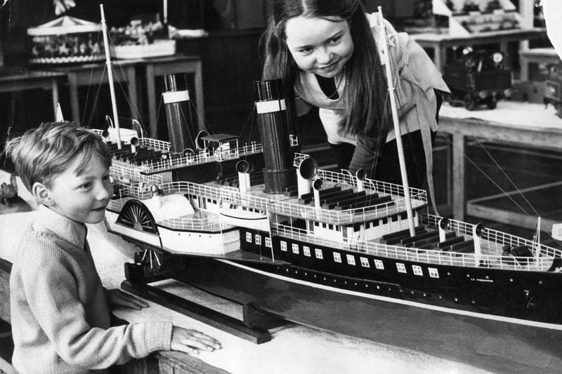John and Mary Benvin looking at a model of the steam packet La Marguerite. It was on show in a model engineering exhibition held in Perth Green School.