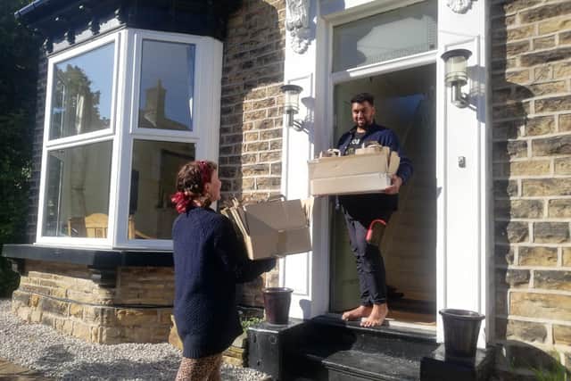 Volunteers at the newly formed community hub help deliver food parcels.