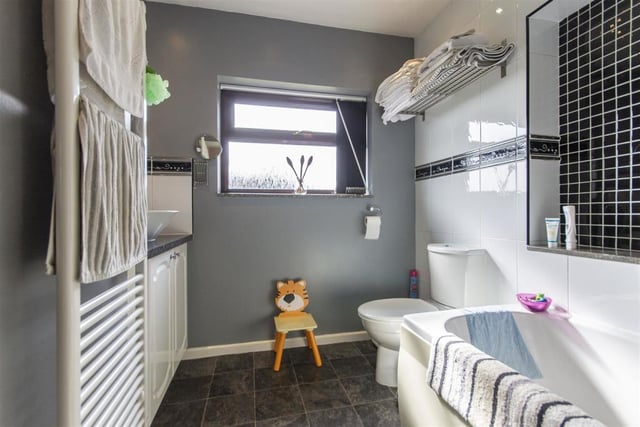 Fitted with a white three-piece suite, this room contains a bath with electric shower over, wash basin and wc.